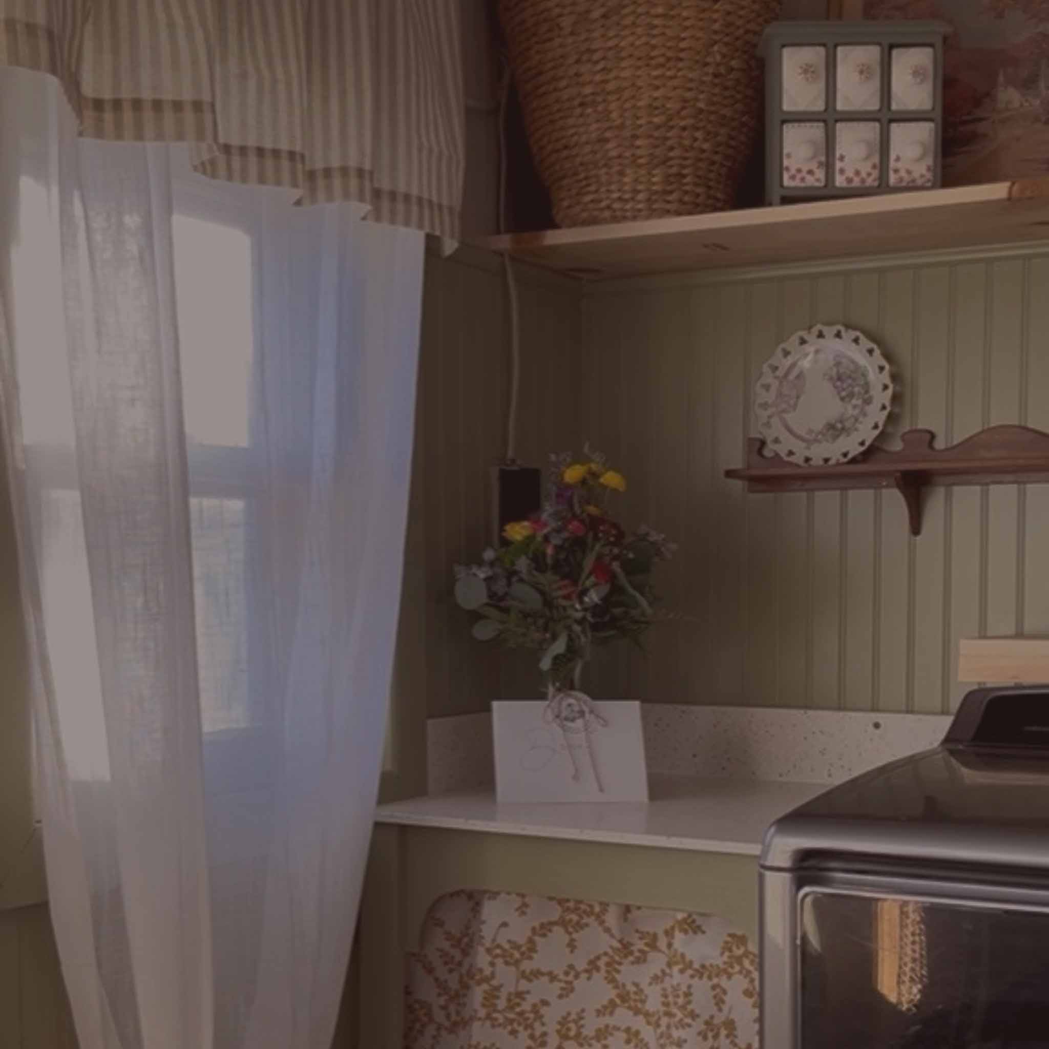 Laundry nook with floral details and woven baskets