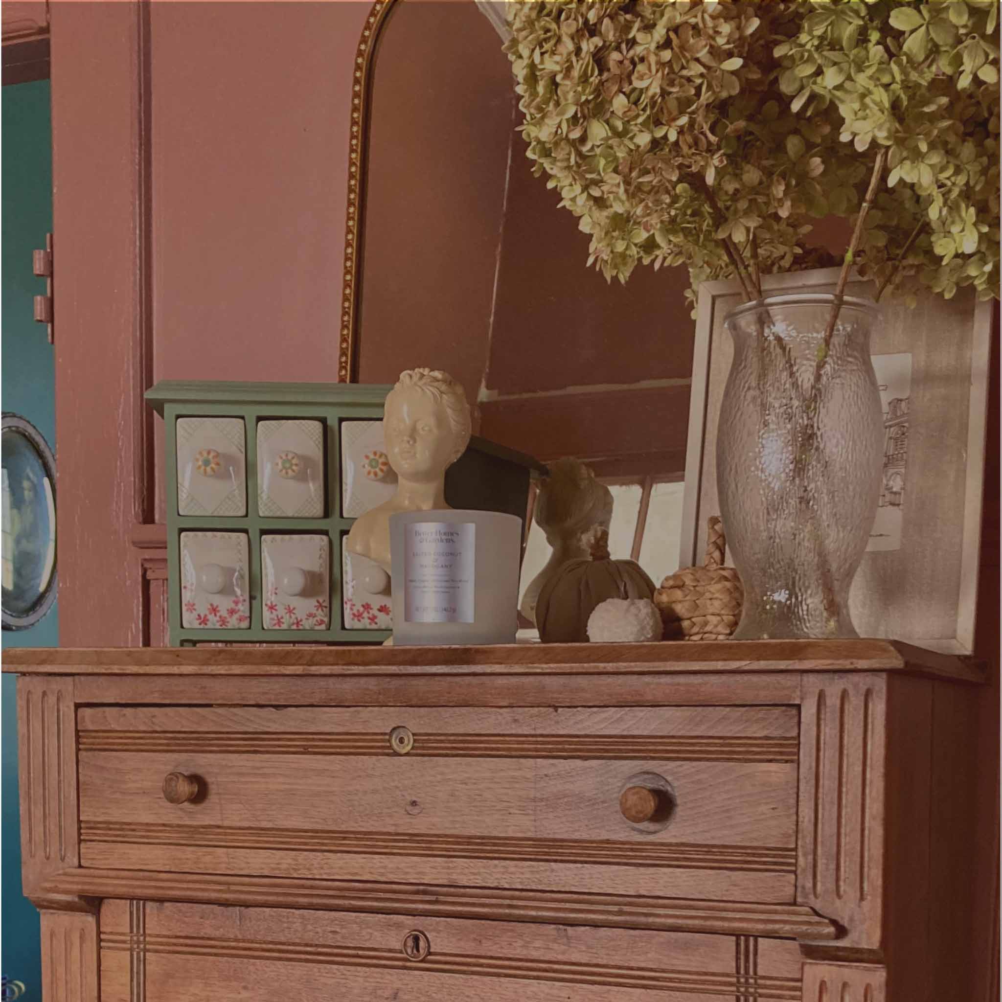 Styled vintage dresser with mirror and dried florals