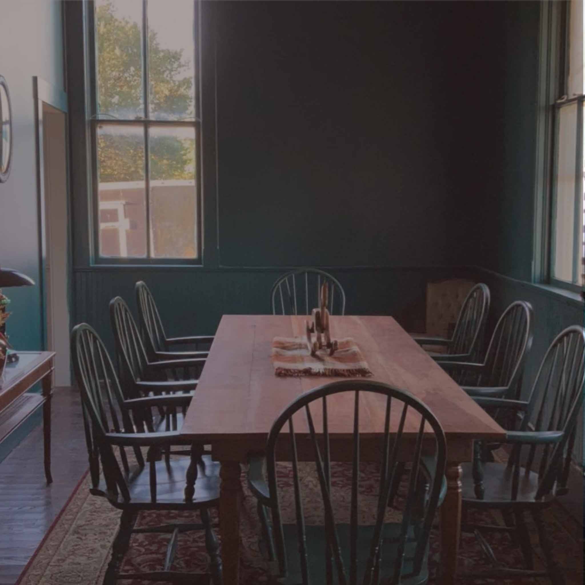 Interior dining room with vintage chairs and natural light
