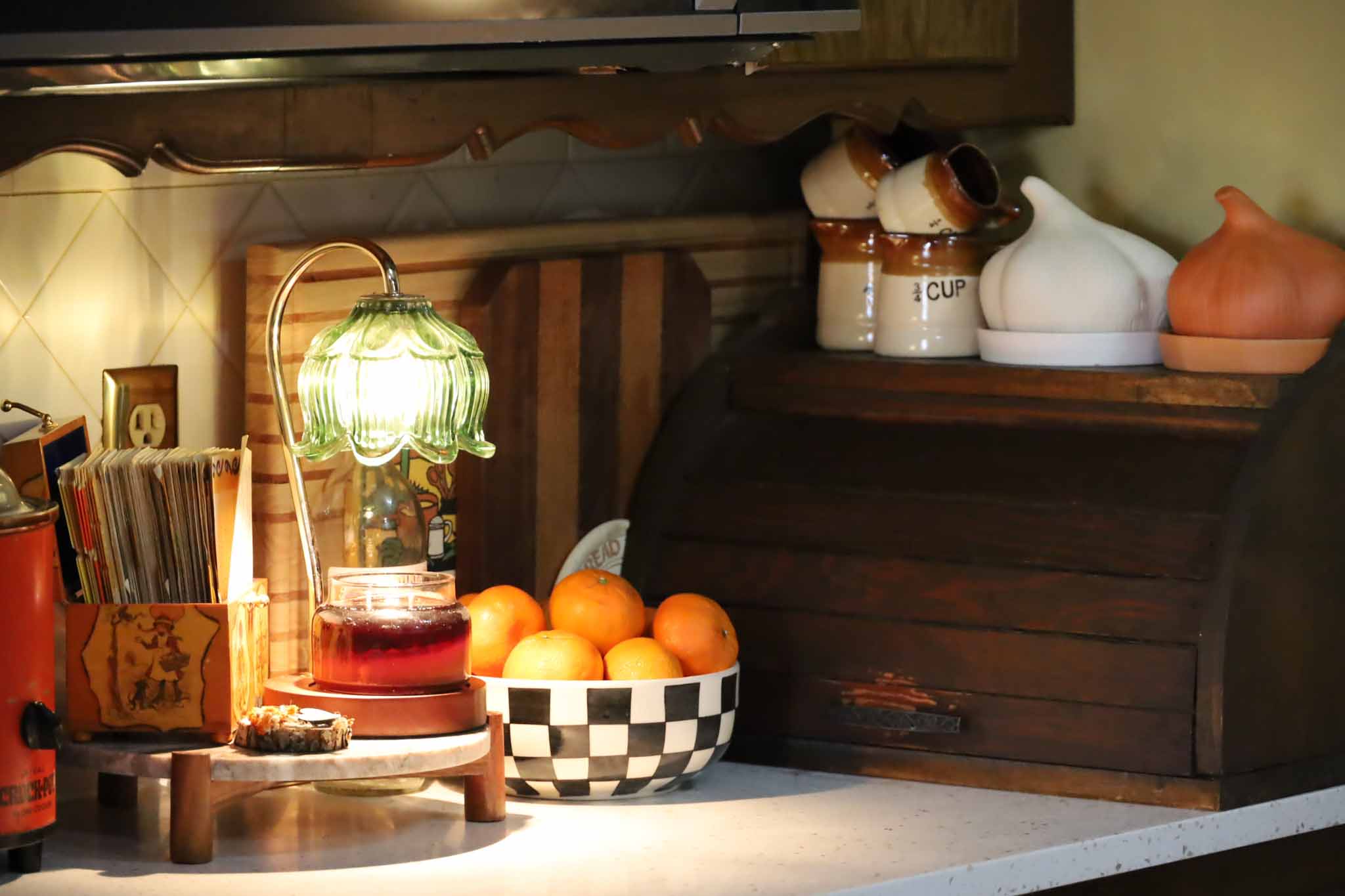 Kitchen counter with vintage crock-pot and warm lighting