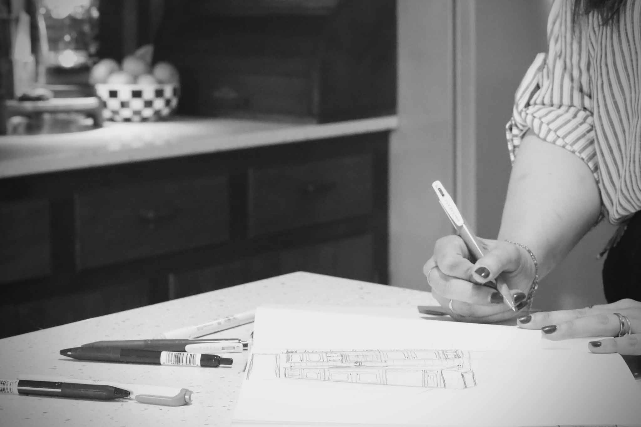 Sarah Stewart sketching interior designs